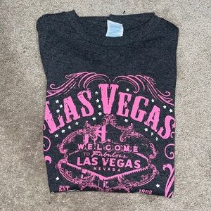 Size Medium in woman’s. Grey and pink Las Vegas shirt.